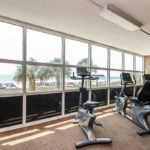 A fitness center with ellipticals