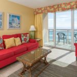 living room with balcony view at bahama sands luxury condominiums