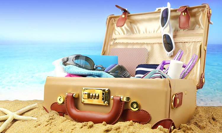 suitcase on sandy beach